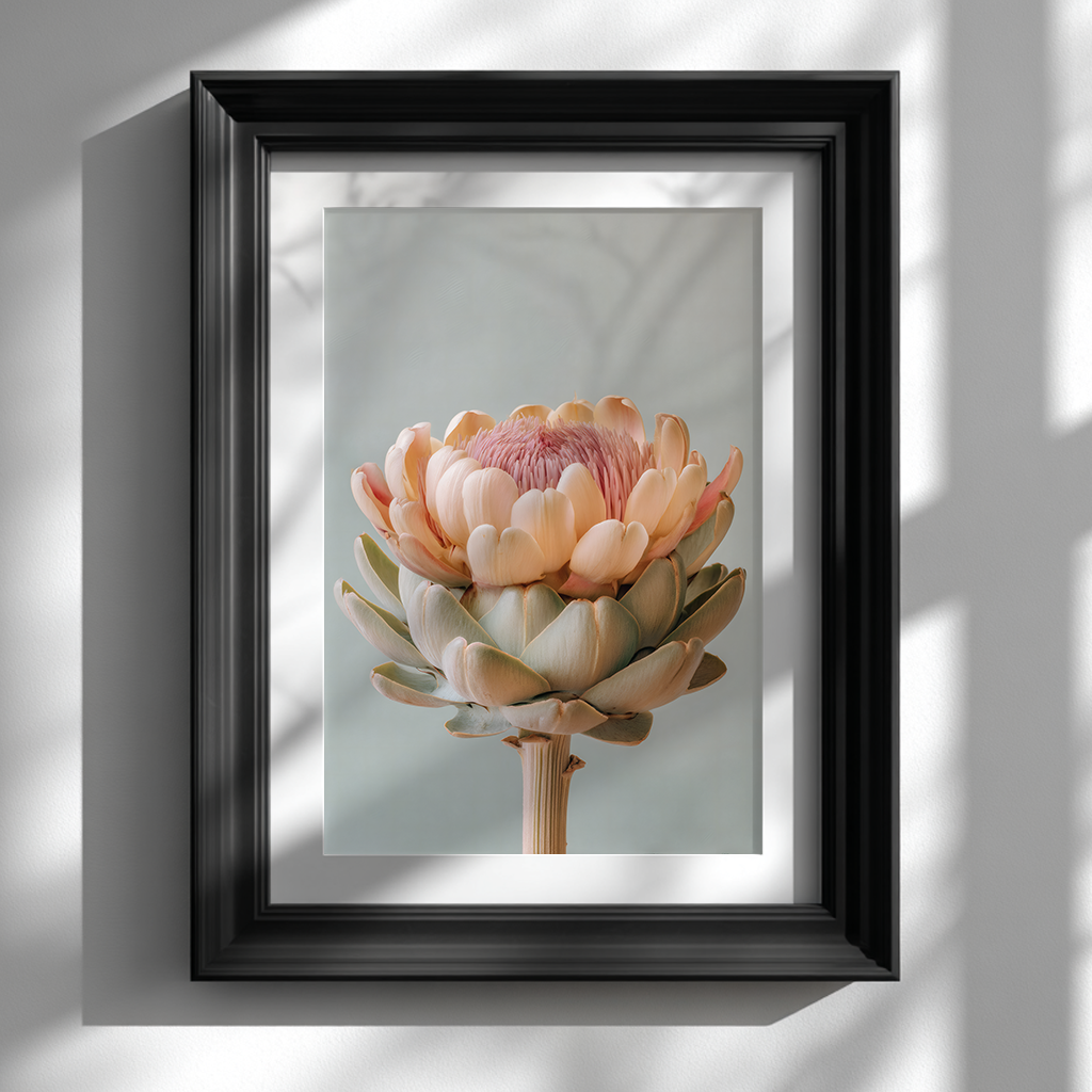 black frame picture on white wall featuring pastel artichoke botanical poster