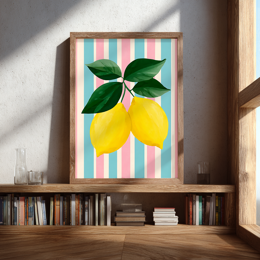 Framed lemon art print with pastel stripes displayed on a wooden bookshelf, bright natural light, modern home decor
