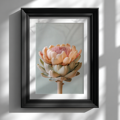 black frame picture on white wall featuring pastel artichoke botanical poster
