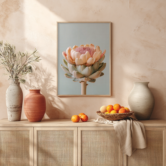 botanical pastel artichoke wall art styled on a mantle with rustic ceramic vases
