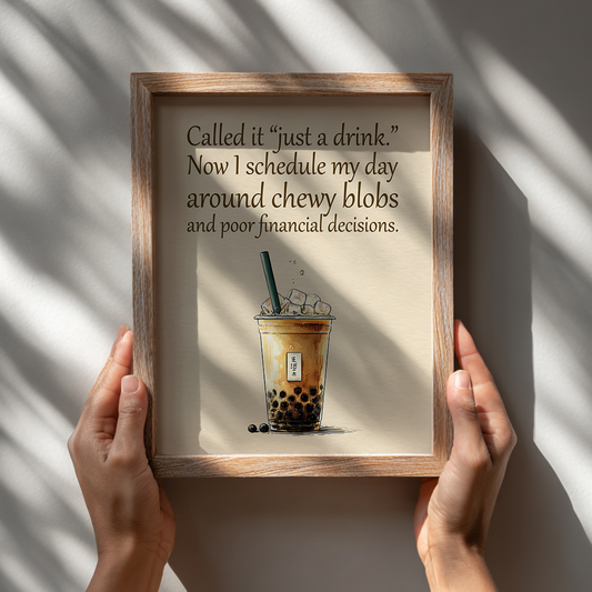 Playful bubble tea quote poster with inspirational text displayed in wooden frame being held by hands

