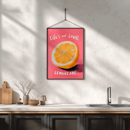 Quirky lemon print with bold colours and motivational message displayed in kitchen setting for fun wall decor

